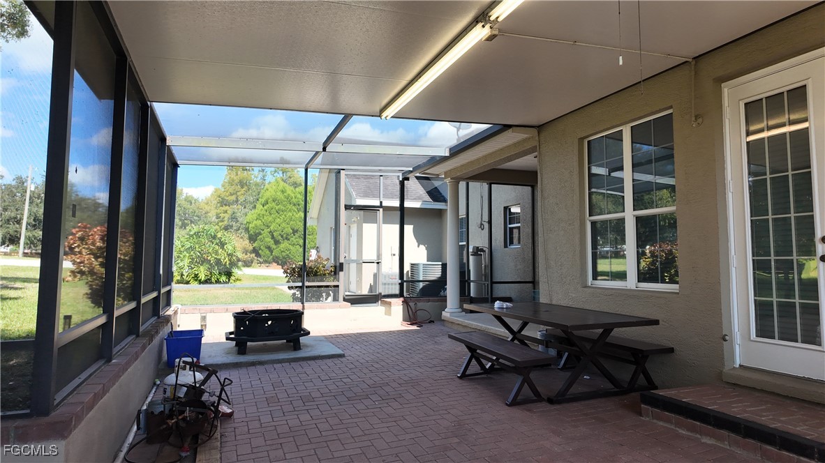 965 Stenstrom Road Wauchula, FL 33873 - Photo 23 of 25 a living room with furniture and large windows