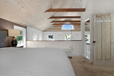 a view of a hallway with a lot of white walls