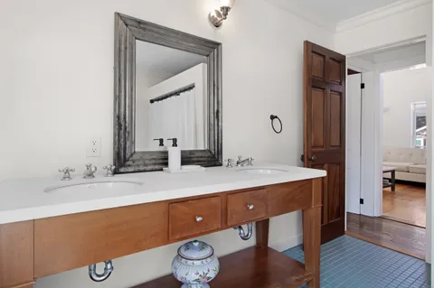 a bathroom with a sink and a mirror
