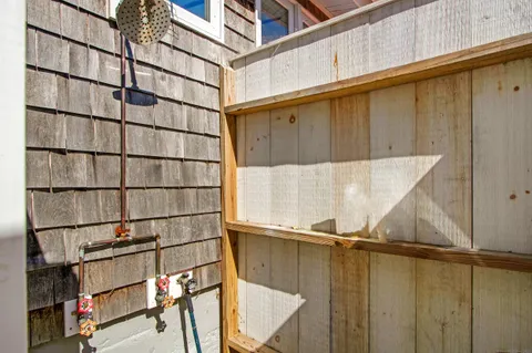 a bathroom with a shower and a window