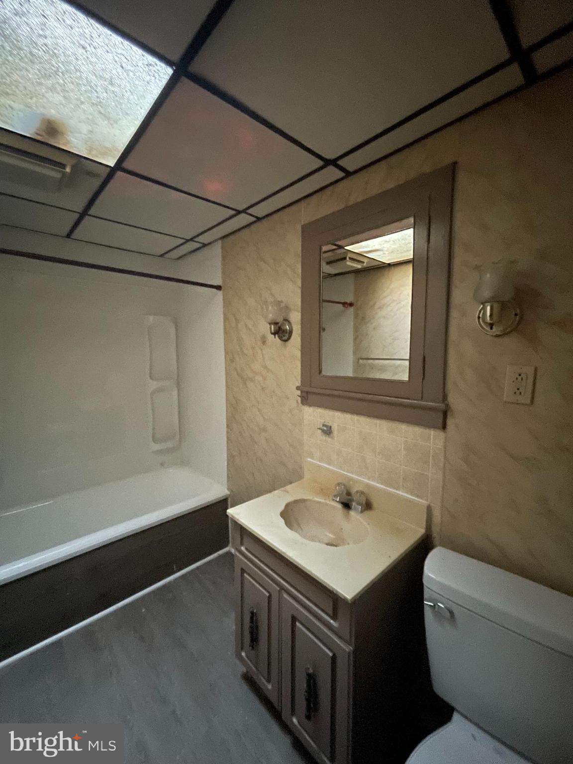 1139 Church Street, Unit D Reading, PA 19601 - Photo 5 of 6 a bathroom with a sink and a mirror