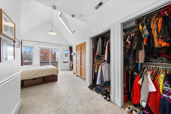 a view of a balcony with furniture