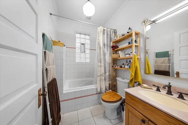 a view of a livingroom with furniture and stairs