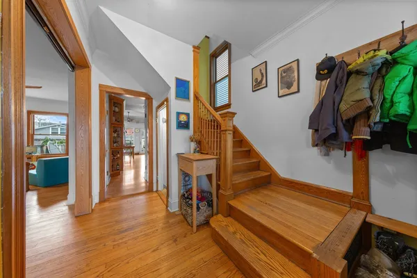 a bedroom with furniture and a book shelf