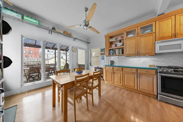 a living room with lots of furniture and a book shelf