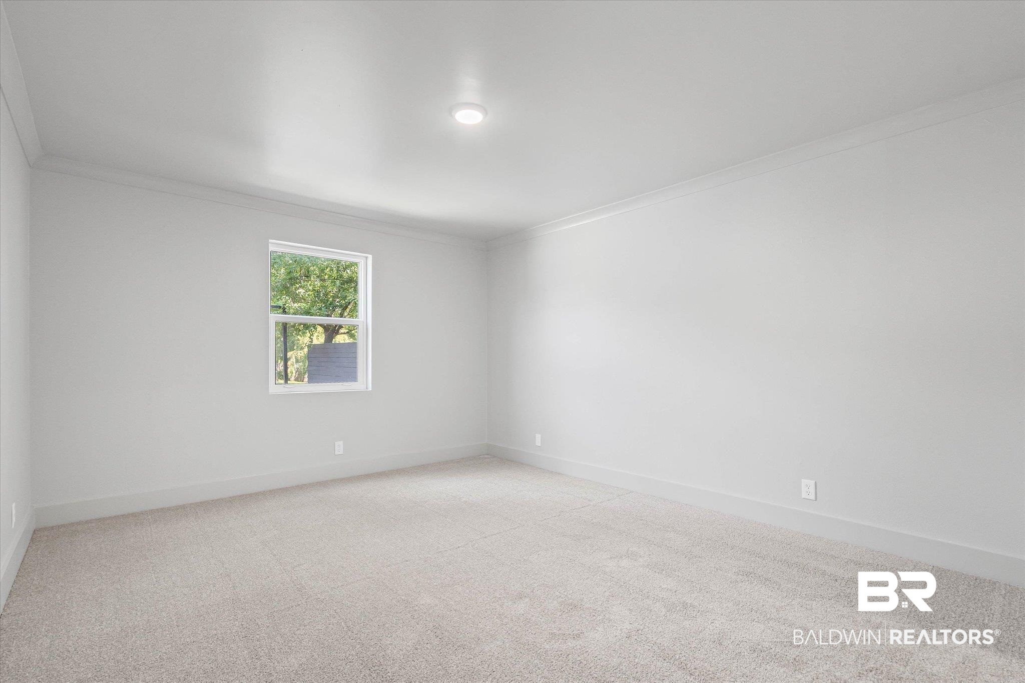 3655 Old Shell Road, Unit 712 Mobile, AL 36608 - Photo 10 of 19 Unfurnished room featuring light carpet and crown molding