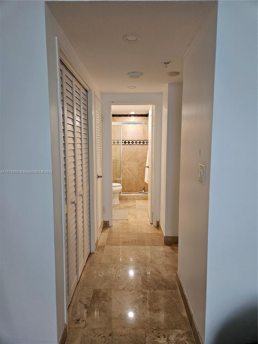 5601 Collins Avenue, Unit 1605 Miami Beach, FL 33140 - Photo 12 of 19 a view of a hallway