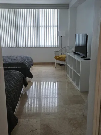 a view of a livingroom with furniture and staircase