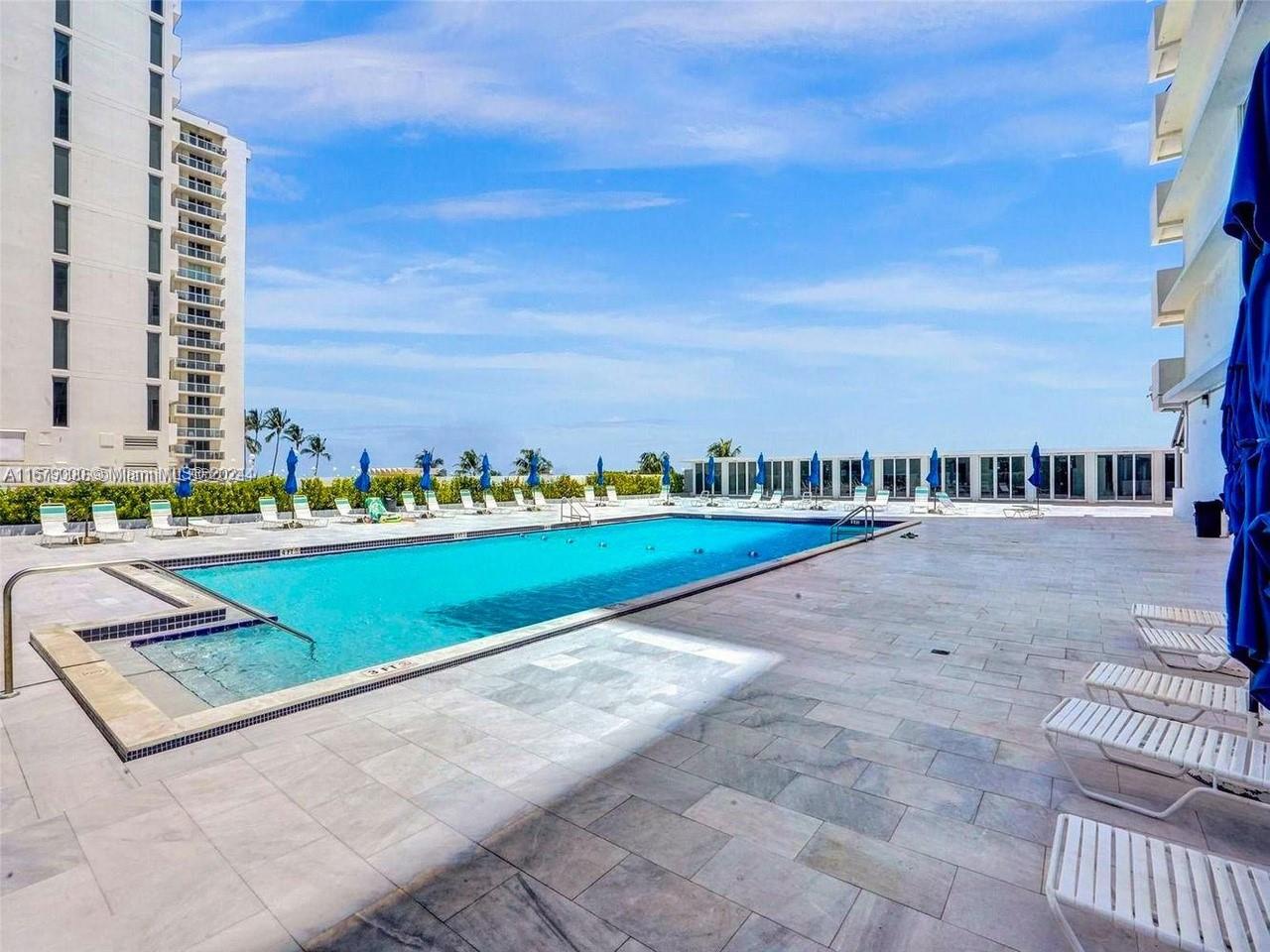 5601 Collins Avenue, Unit 1605 Miami Beach, FL 33140 - Photo 18 of 19 a view of swimming pool with outdoor space and seating area