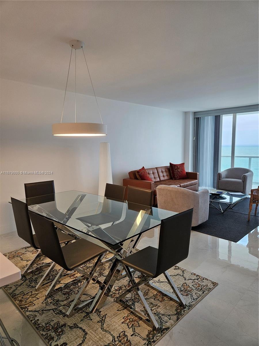 5601 Collins Avenue, Unit 1605 Miami Beach, FL 33140 - Photo 3 of 19 a workspace with furniture and window