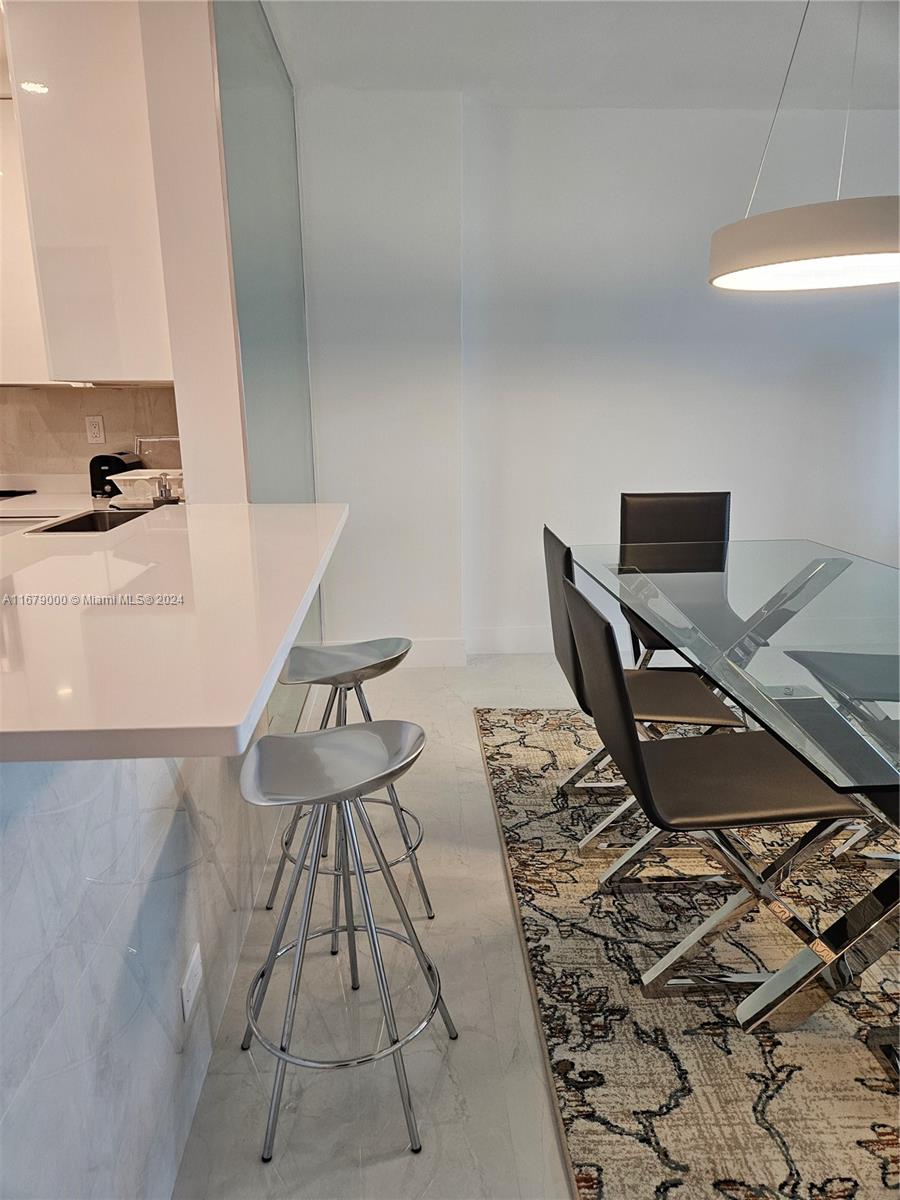 5601 Collins Avenue, Unit 1605 Miami Beach, FL 33140 - Photo 8 of 19 a view of workspace with wooden floor