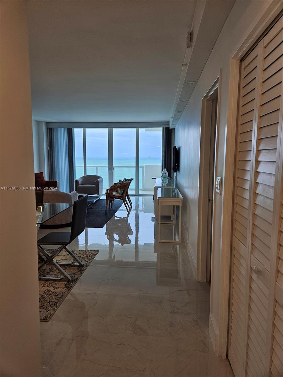 5601 Collins Avenue, Unit 1605 Miami Beach, FL 33140 - Photo 10 of 19 a view of a livingroom with furniture and a window