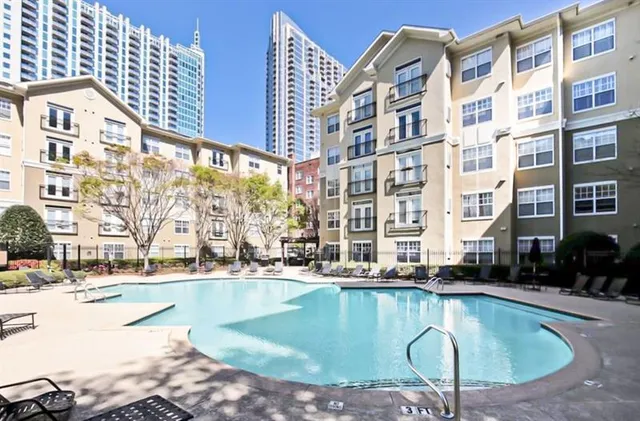 a view of a patio with table and chairs and potted plants