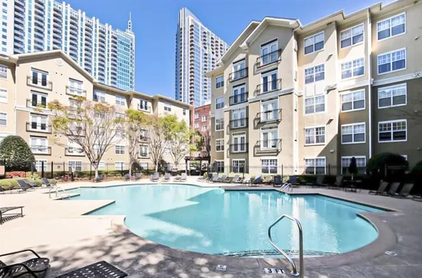 a view of a patio with table and chairs and potted plants