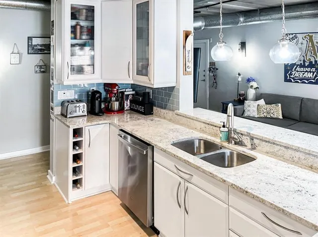 a kitchen with a sink and cabinets