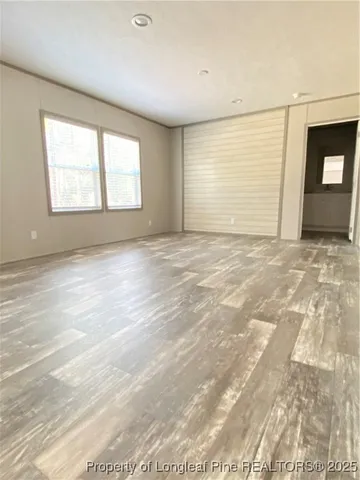 a view of a livingroom with furniture and windows