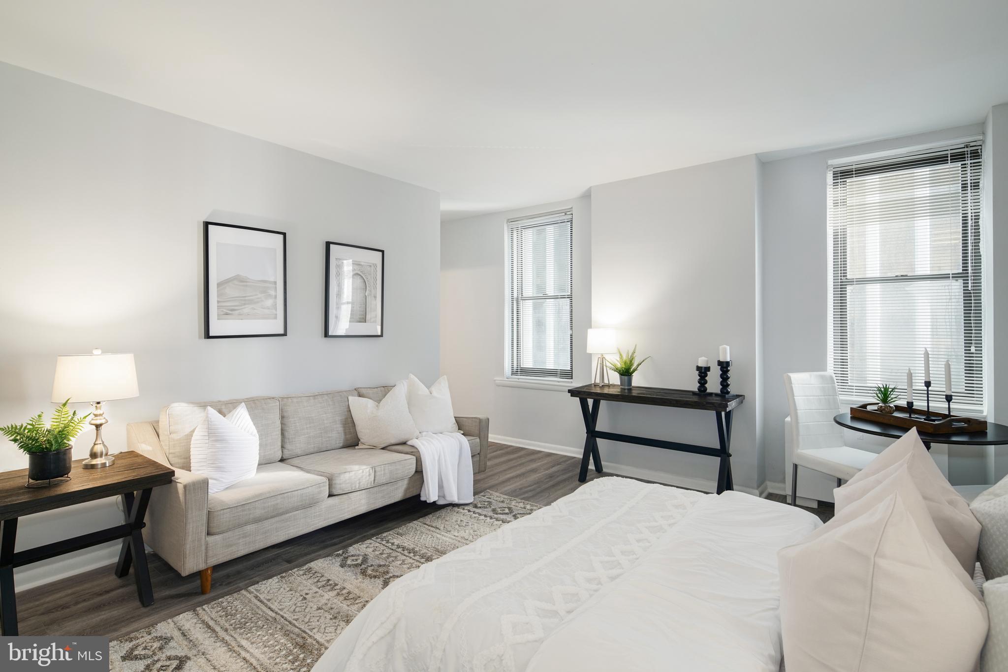 135 South 19th Street, Unit 913 Philadelphia, PA 19103 - Photo 6 of 15 a bedroom with a bed and wooden floor