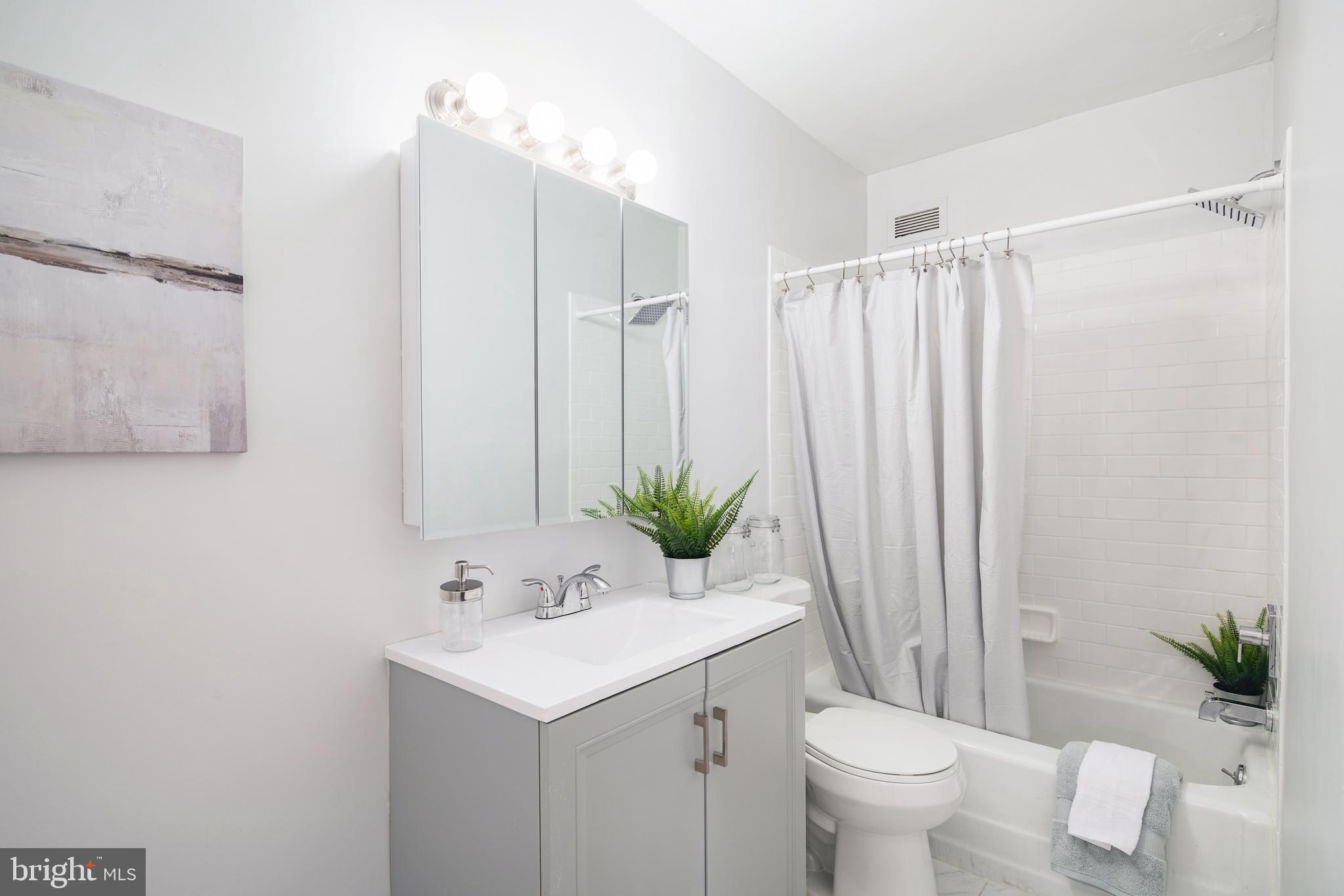 135 South 19th Street, Unit 913 Philadelphia, PA 19103 - Photo 9 of 15 a bathroom with a sink toilet and shower