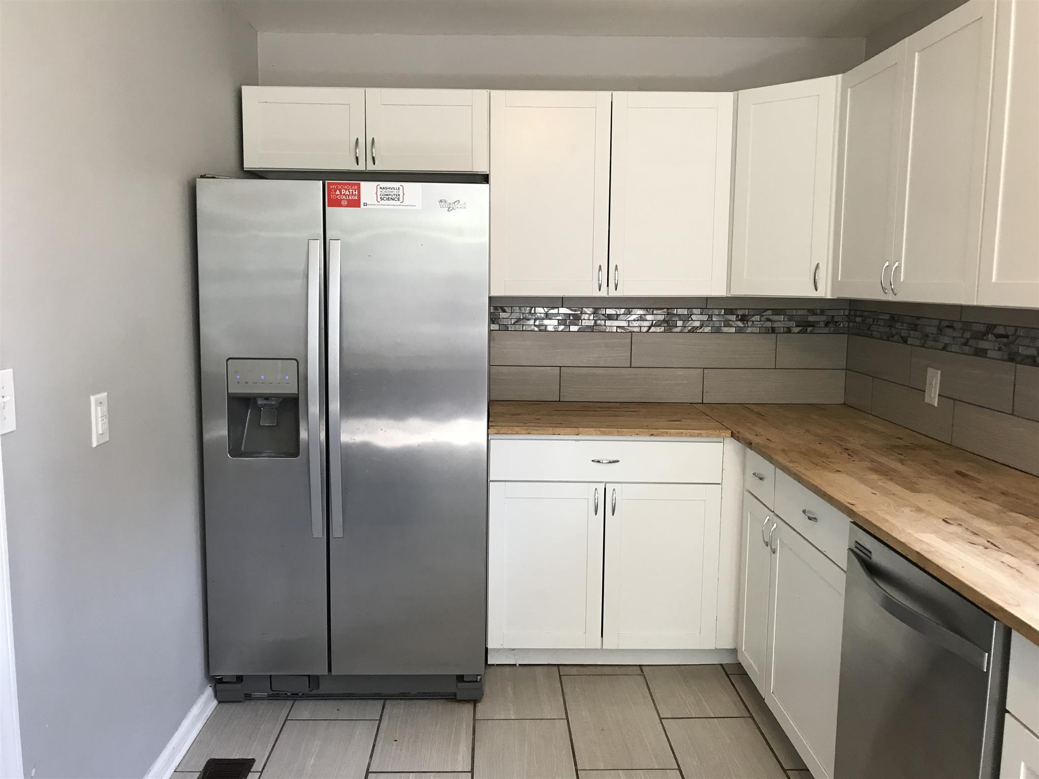 200 Randy Road Madison, TN 37115 - Photo 7 of 18 a white refrigerator freezer sitting inside of a kitchen