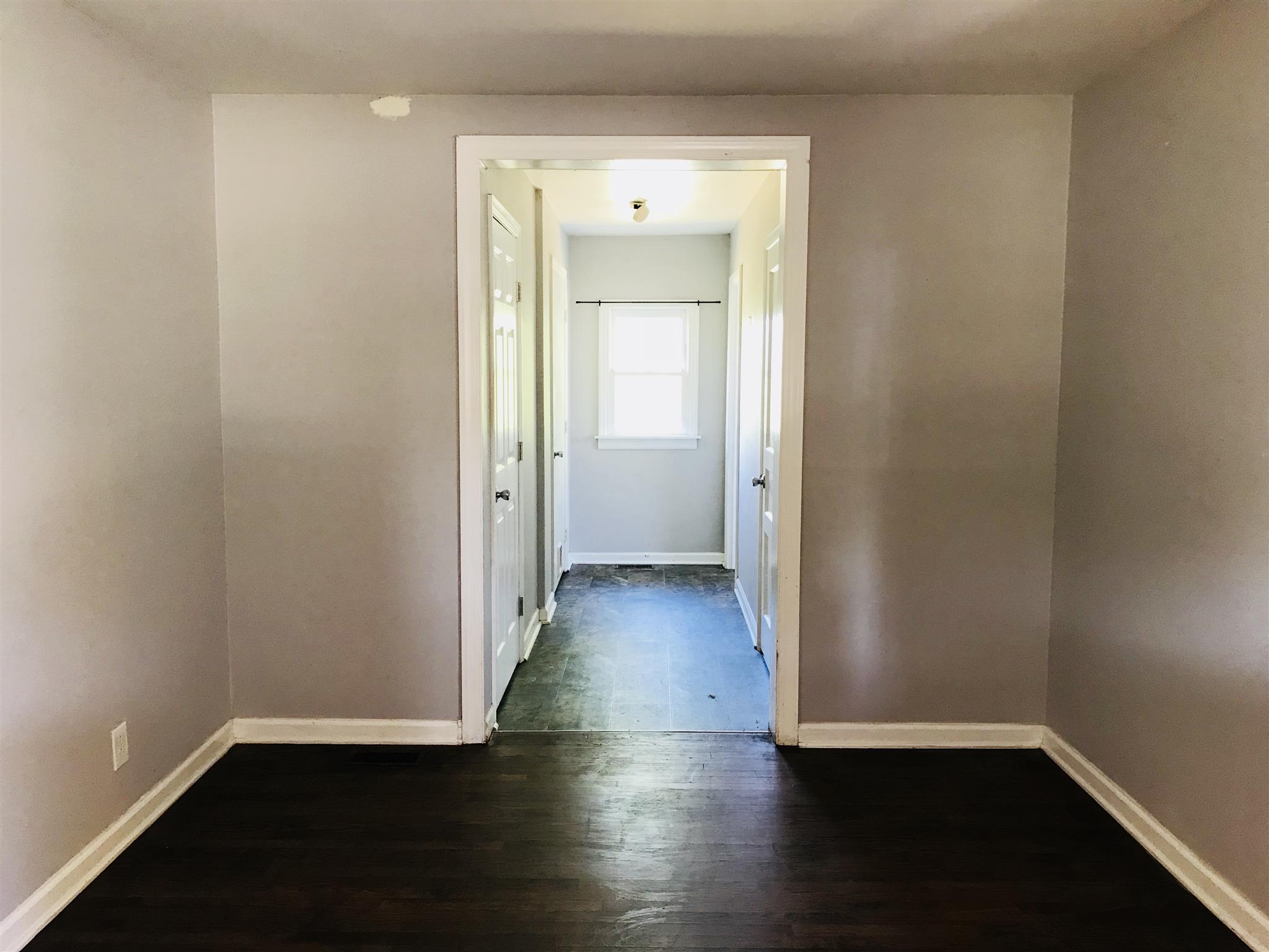 200 Randy Road Madison, TN 37115 - Photo 8 of 18 an empty room with wooden floor and a window