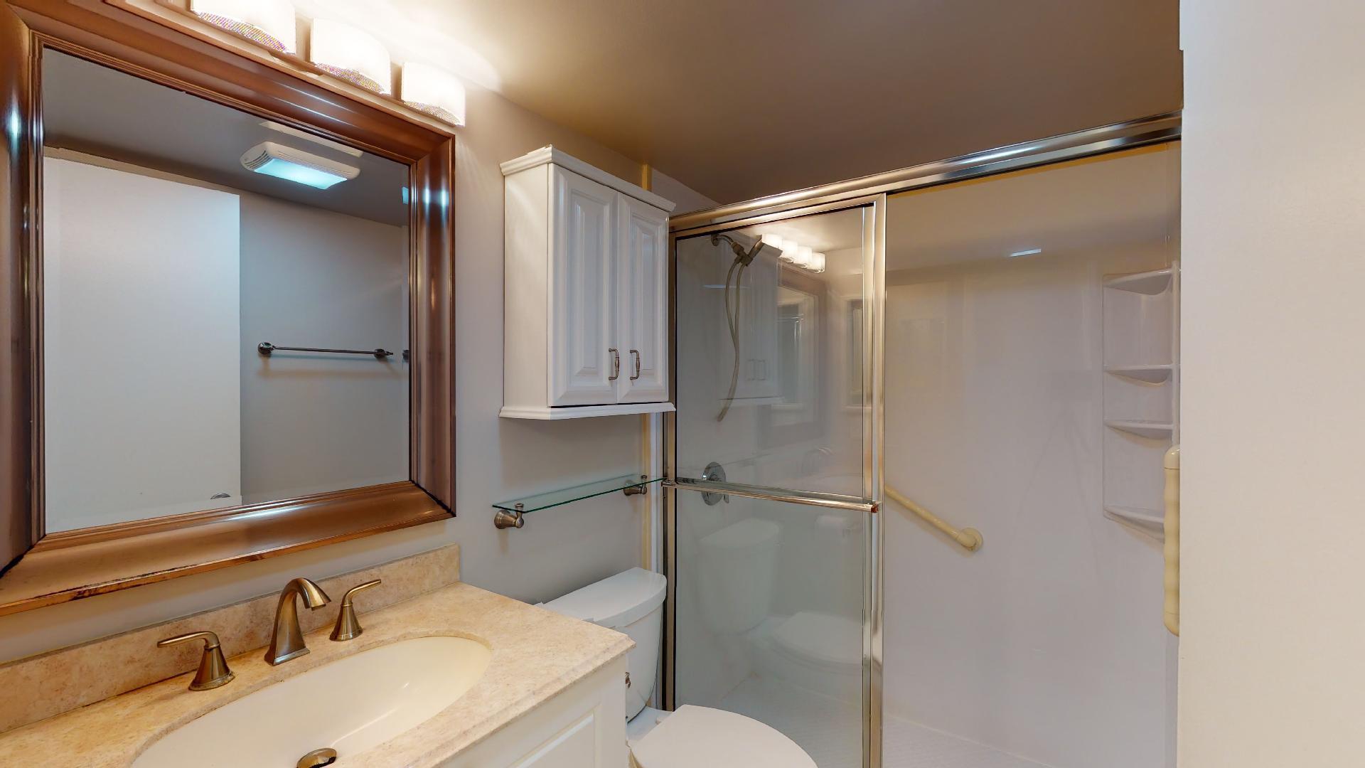 1014 Exeter Boca Raton, FL 33434 - Photo 9 of 31 a bathroom with a sink and mirror