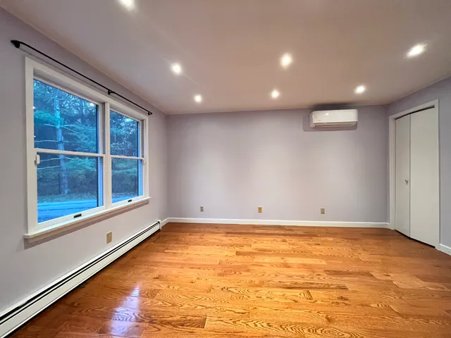 a bathroom with a bathtub and shower