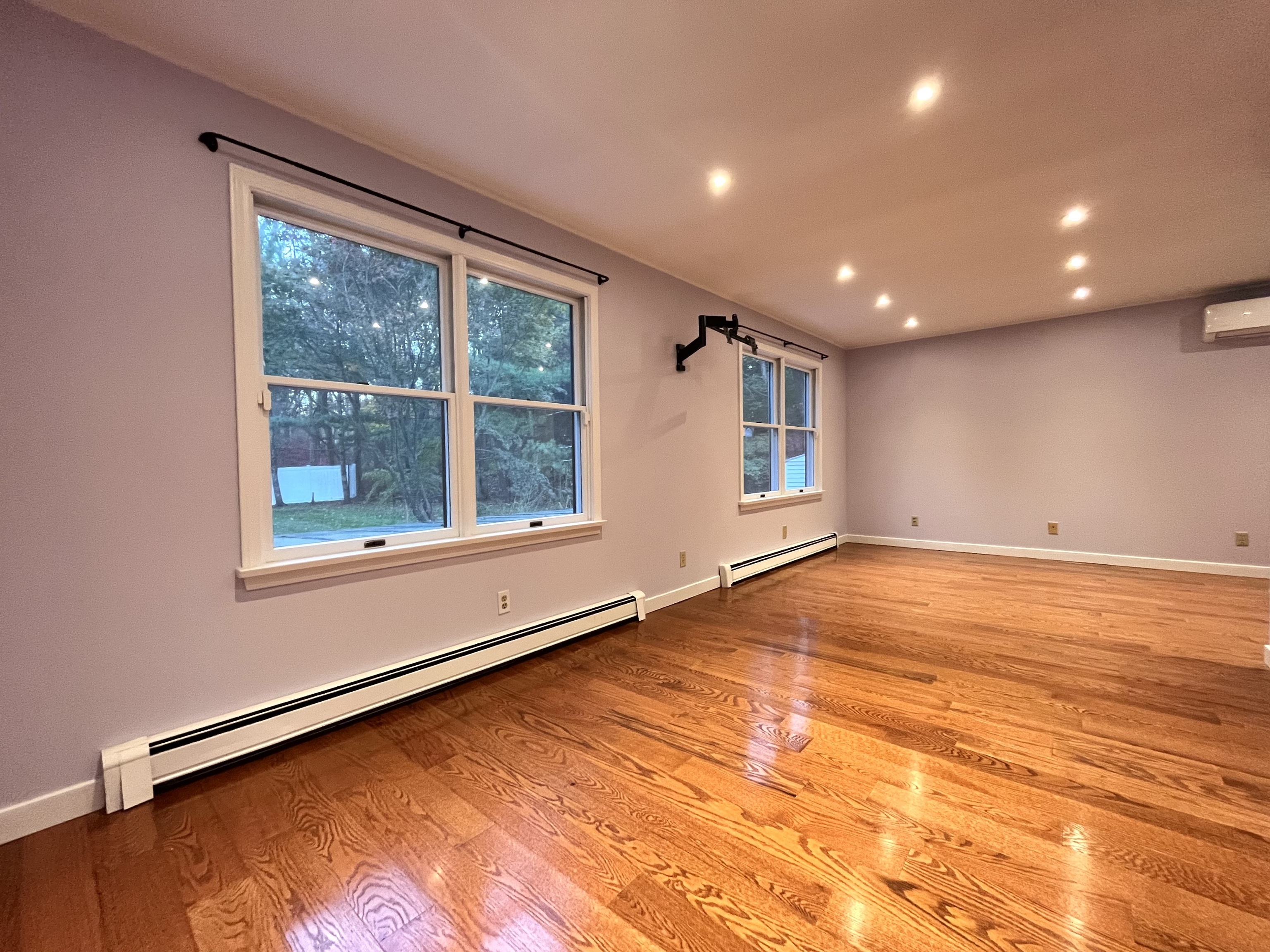 158 Jelliff Mill Road New Canaan, CT 06840 - Photo 15 of 40 a view of an empty room with wooden floor and a window