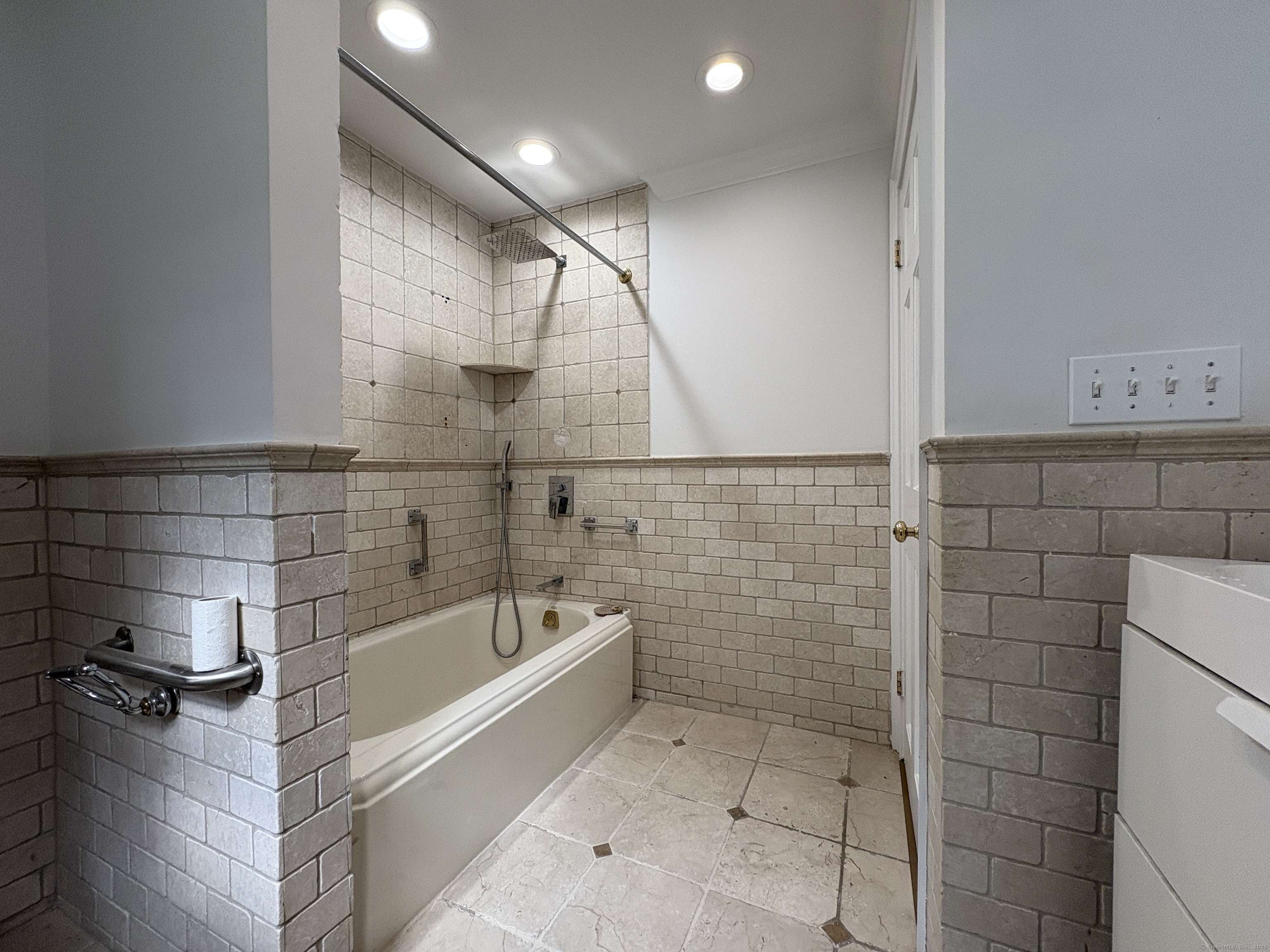 158 Jelliff Mill Road New Canaan, CT 06840 - Photo 18 of 40 a bathroom with a bathtub and shower