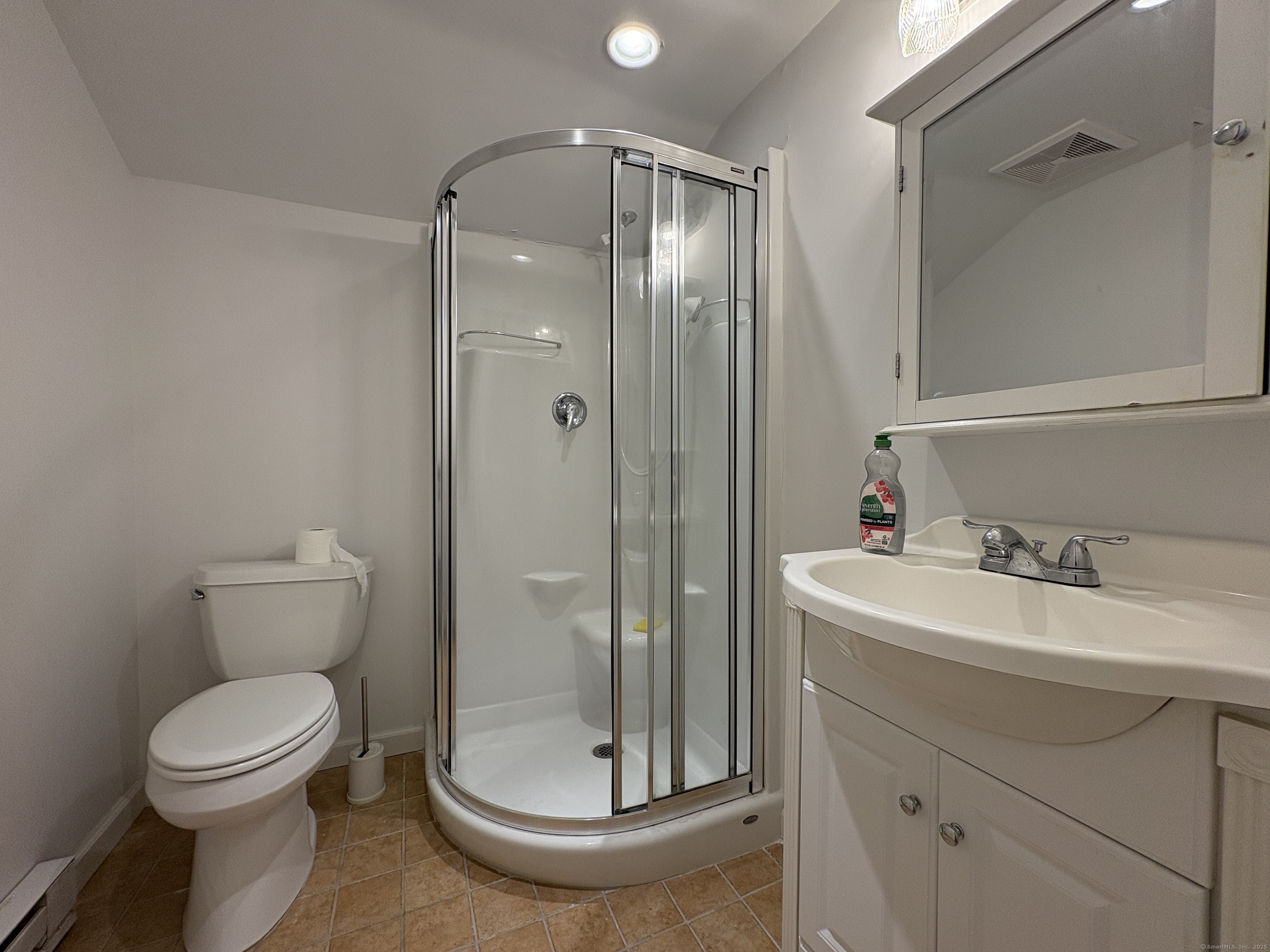 158 Jelliff Mill Road New Canaan, CT 06840 - Photo 25 of 40 a bathroom with a toilet sink and shower