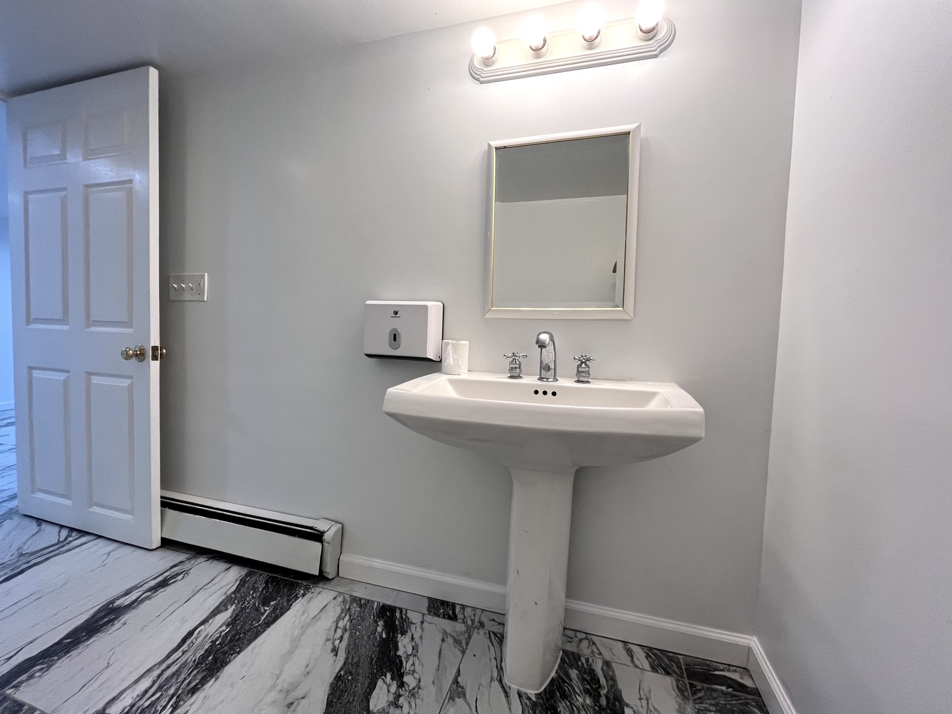 158 Jelliff Mill Road New Canaan, CT 06840 - Photo 28 of 40 a bathroom with a sink a mirror and toilet