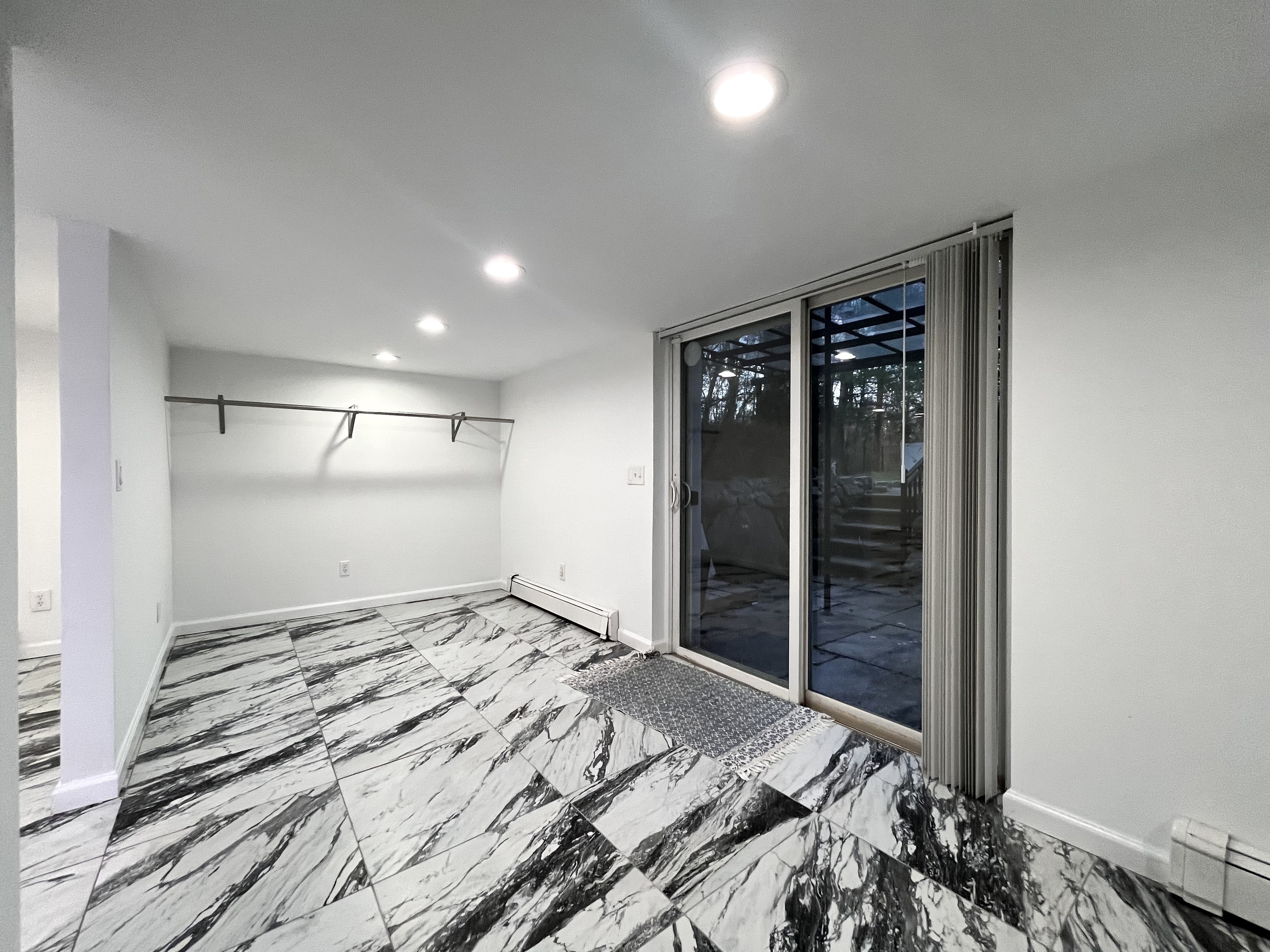 158 Jelliff Mill Road New Canaan, CT 06840 - Photo 32 of 40 a view of a room with a bed and wooden floor