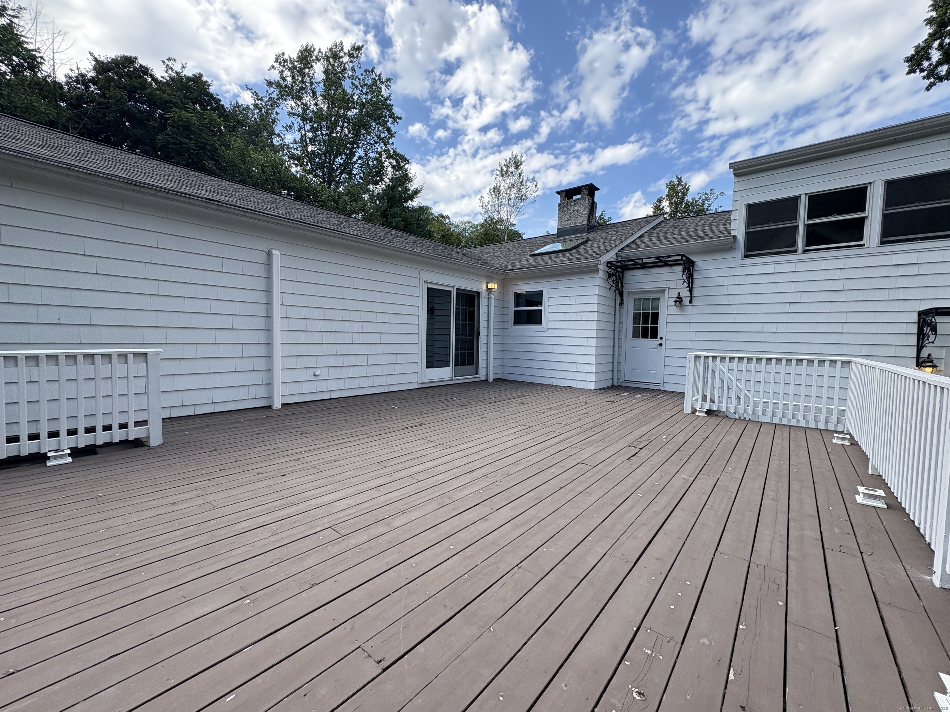 158 Jelliff Mill Road New Canaan, CT 06840 - Photo 35 of 40 a view of a house with a roof deck