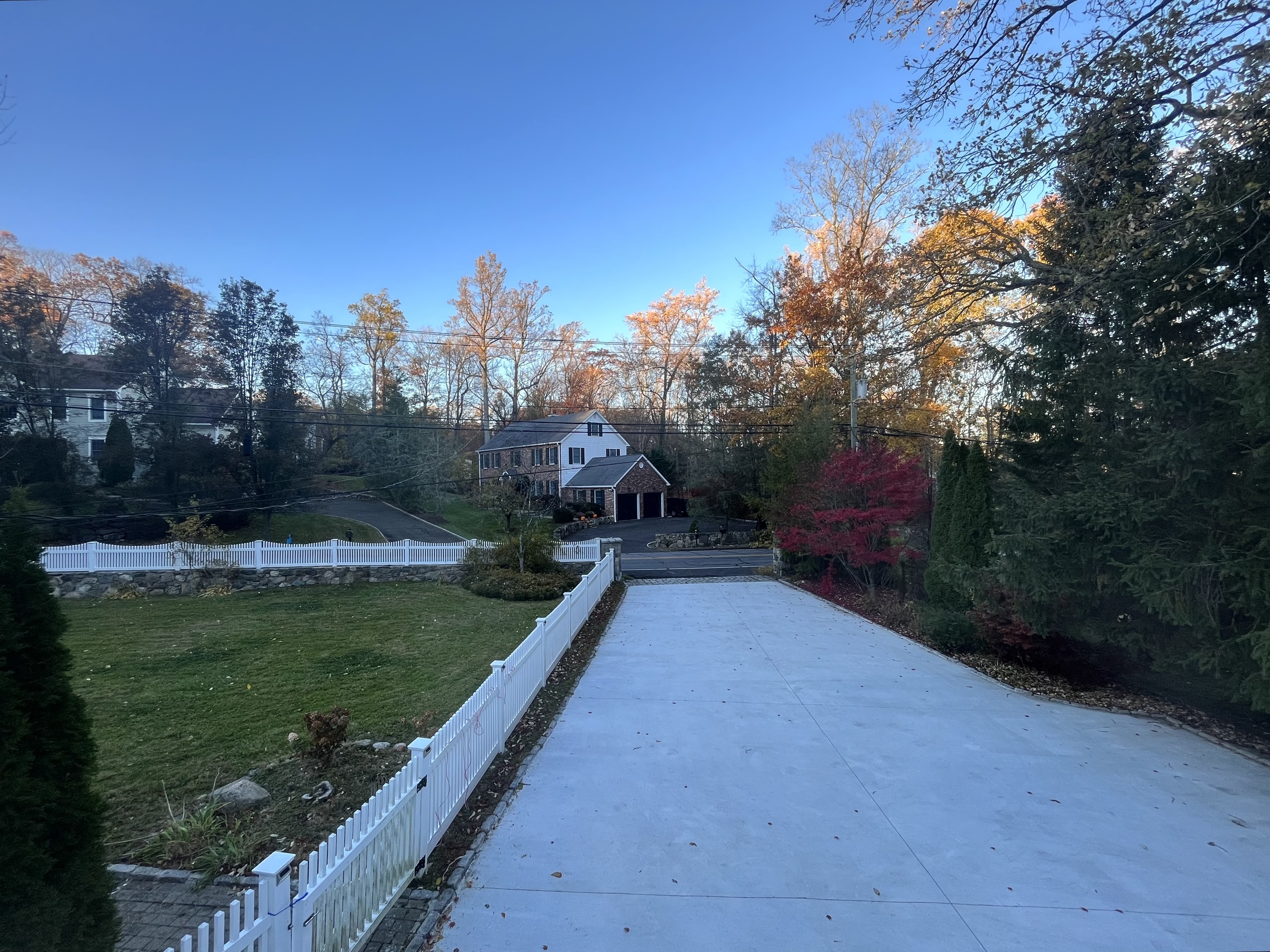 158 Jelliff Mill Road New Canaan, CT 06840 - Photo 40 of 40 a view of a garden with a bench in the background