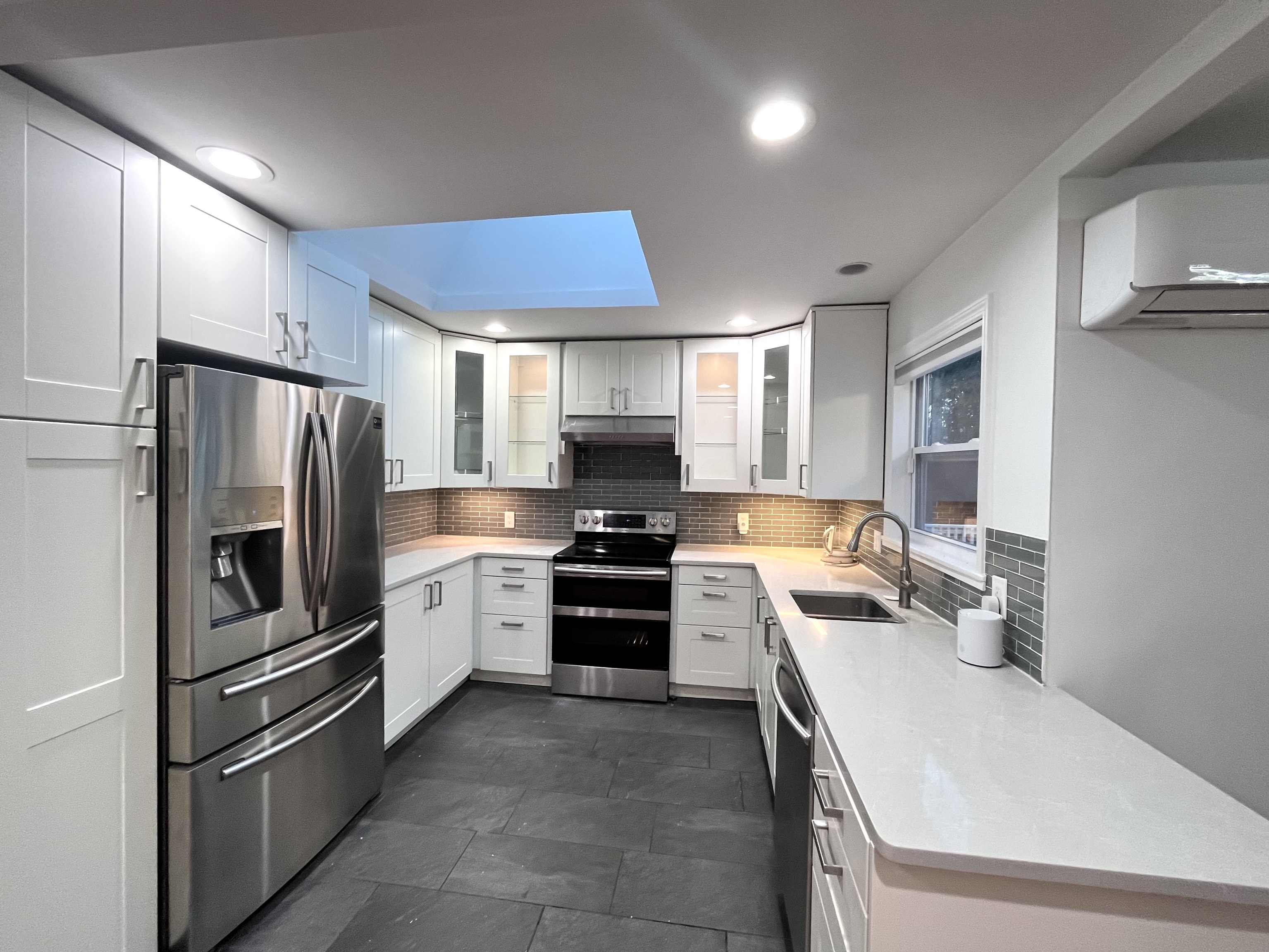 158 Jelliff Mill Road New Canaan, CT 06840 - Photo 7 of 40 a kitchen with a refrigerator stove and sink
