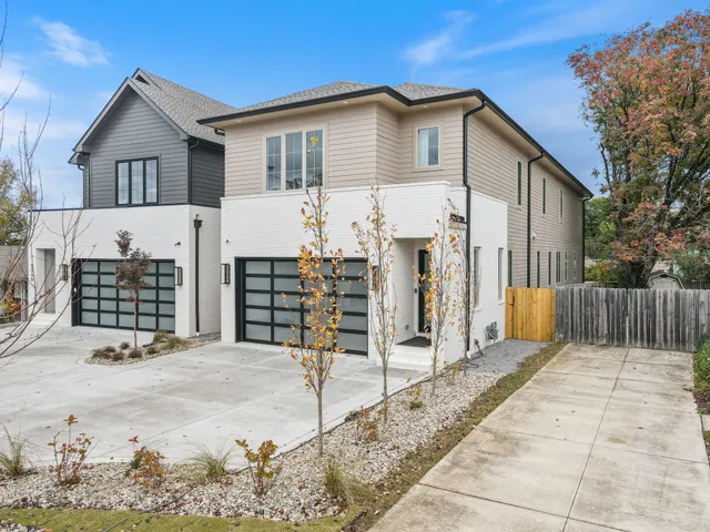 a view of a house with wooden fence