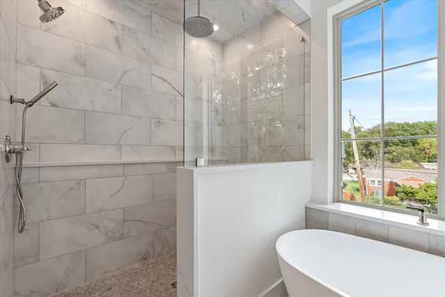 a view of a hallway with wooden floor and closet