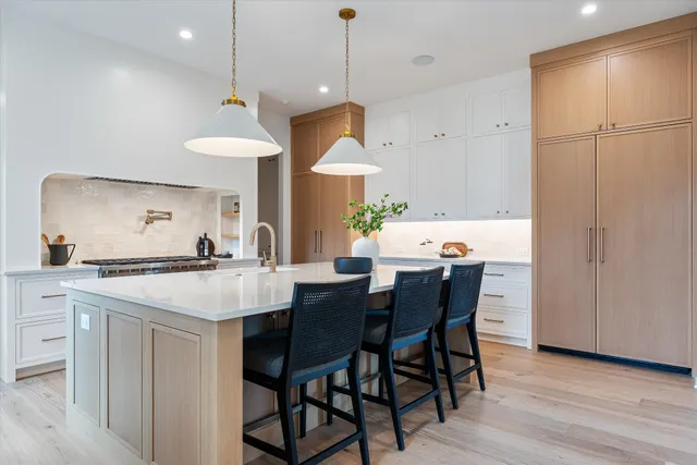 a kitchen with a table and chairs in it