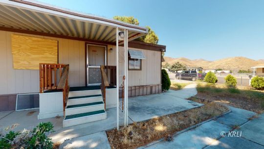 3816 Goat Ranch Road Mountain Mesa, CA 93240 - Photo 14 of 20 a view of a house with backyard porch and wooden floor