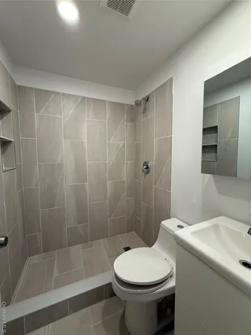 an empty room with a empty space and windows