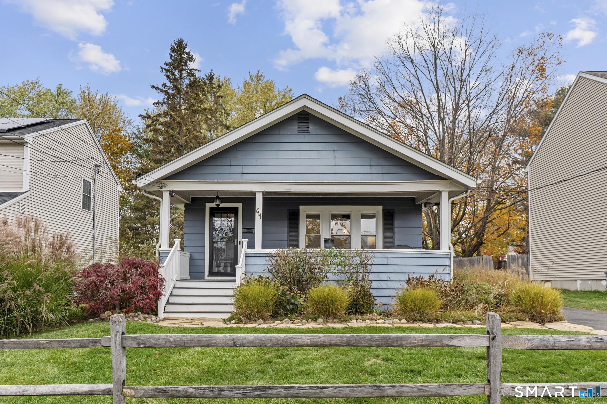 64 Douglas Road Bristol, CT 06010 - Photo 1 of 40 a view of a house with a yard and plants
