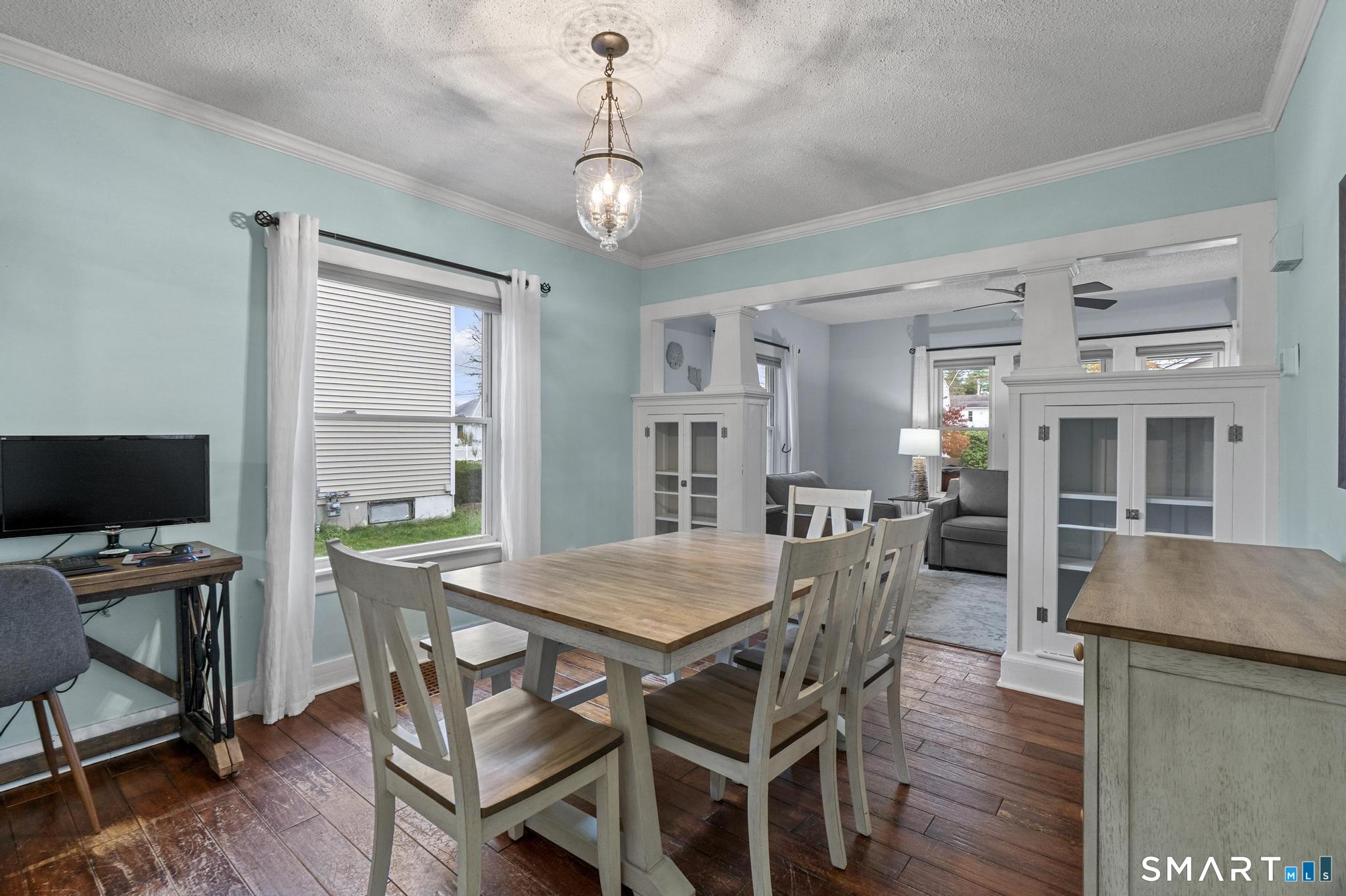 64 Douglas Road Bristol, CT 06010 - Photo 11 of 40 a view of a dining room with furniture window and wooden floor