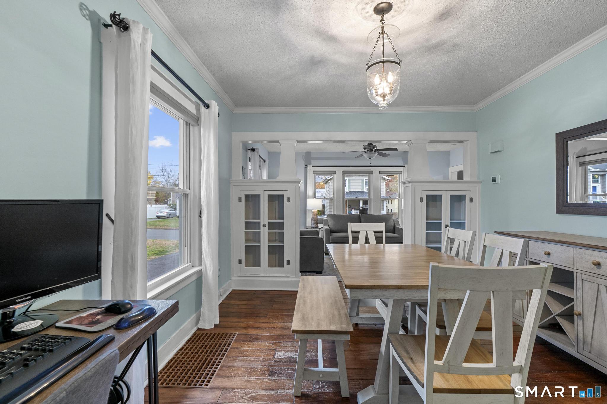 64 Douglas Road Bristol, CT 06010 - Photo 12 of 40 a view of a dining room with furniture wooden floor and chandelier