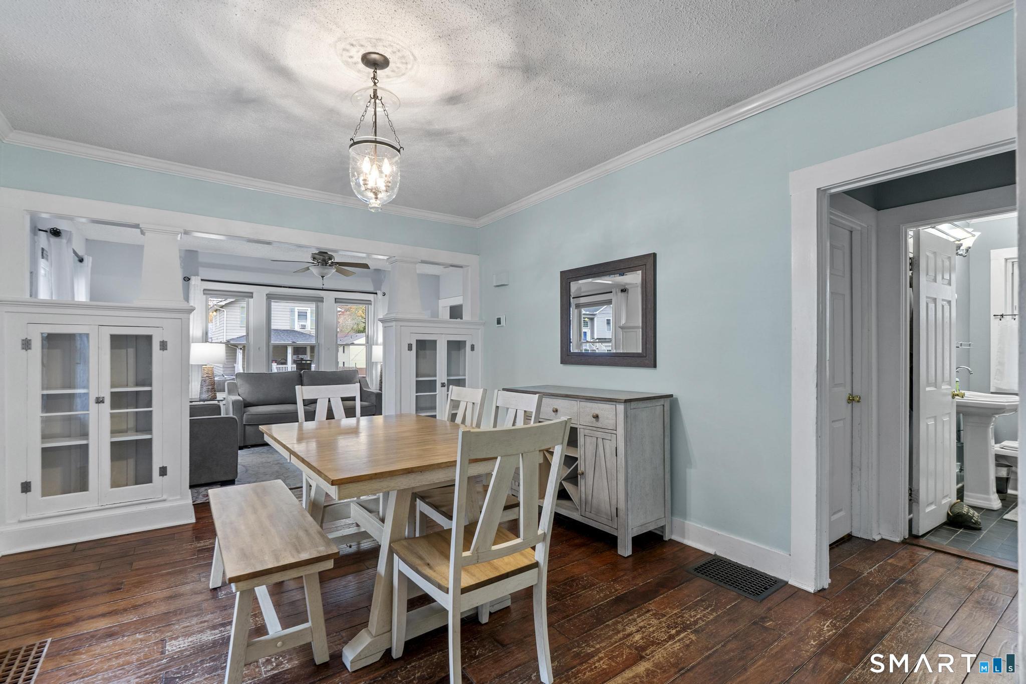 64 Douglas Road Bristol, CT 06010 - Photo 13 of 40 a view of a dining room with furniture wooden floor and chandelier