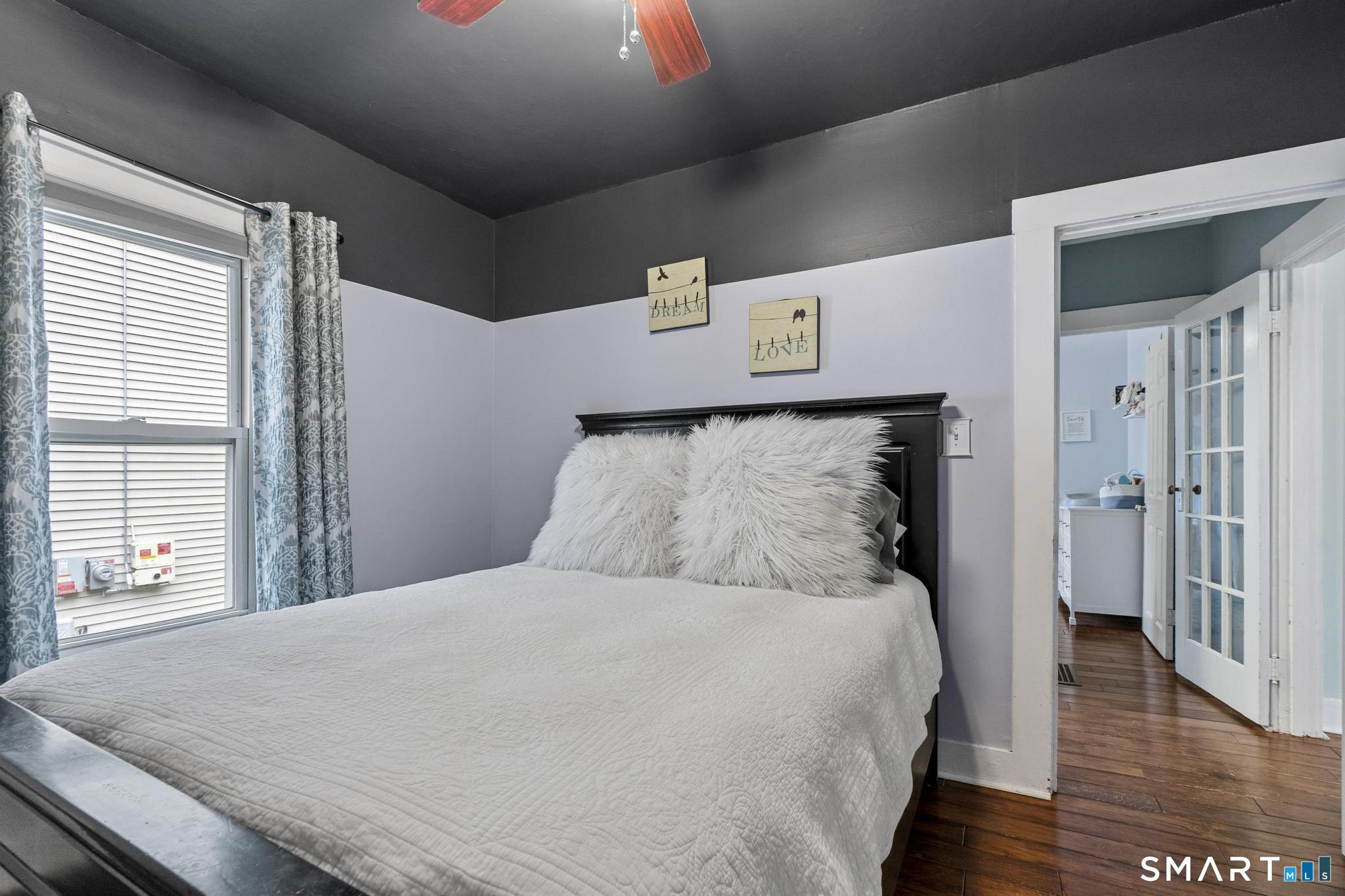 64 Douglas Road Bristol, CT 06010 - Photo 24 of 40 a large bed sitting in a bedroom next to a window