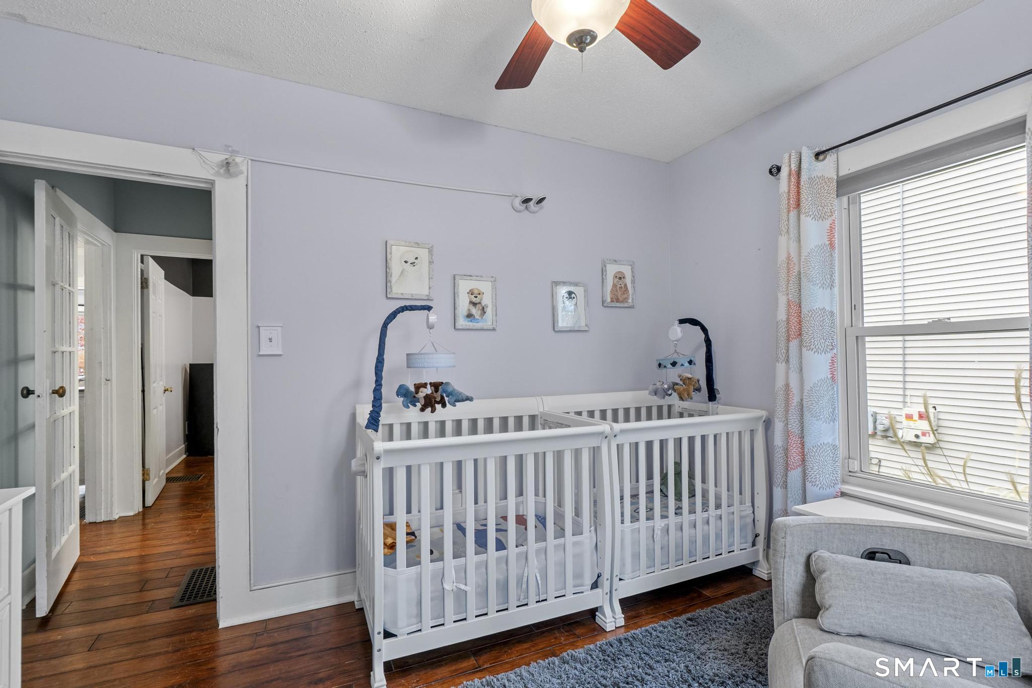 64 Douglas Road Bristol, CT 06010 - Photo 30 of 40 a view of a bedroom with wooden floor & a window