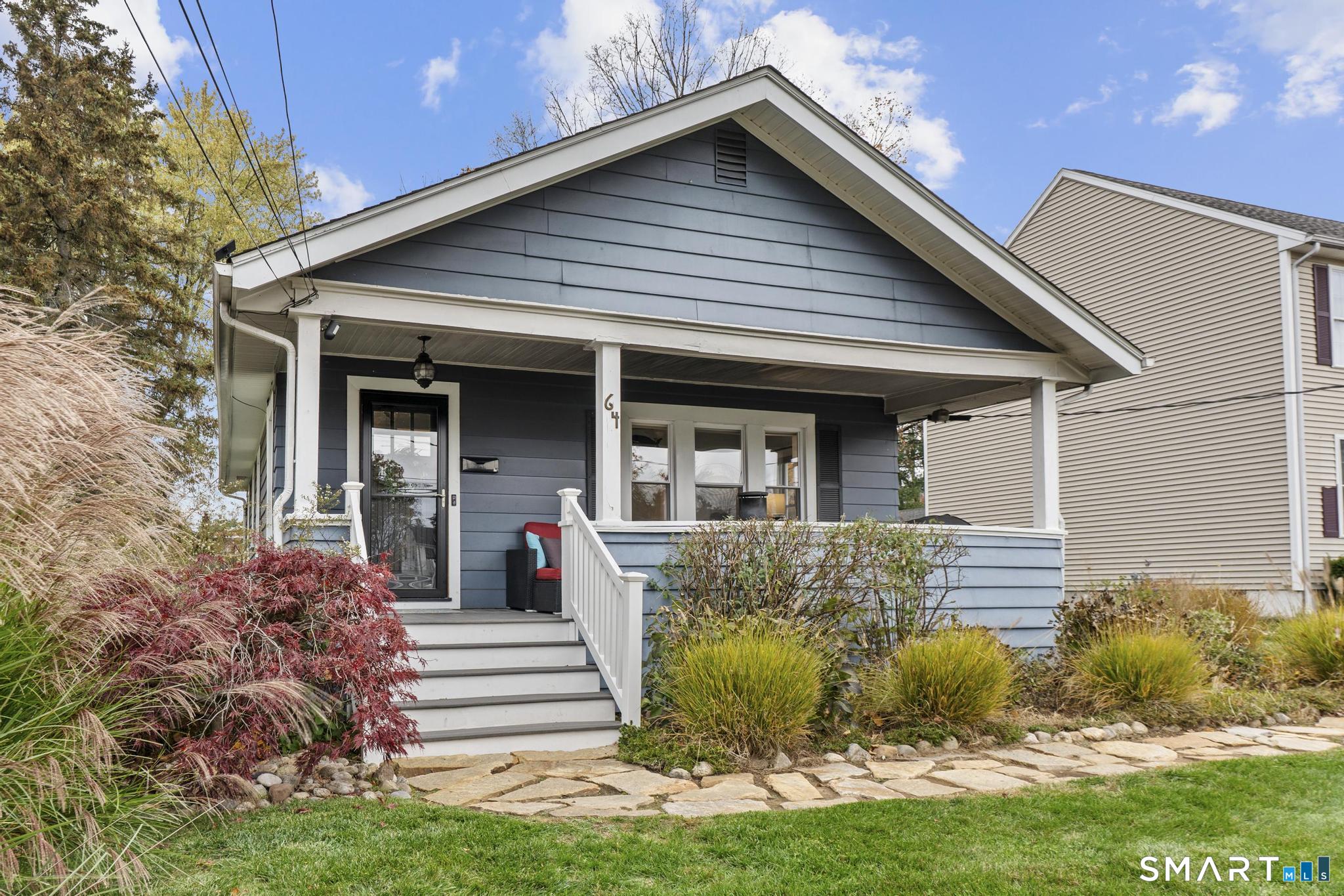 64 Douglas Road Bristol, CT 06010 - Photo 3 of 40 a view of a house with potted plants and a large tree