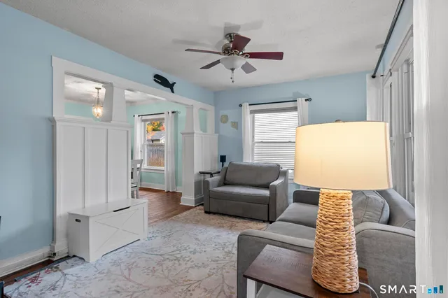 a living room with furniture and a window