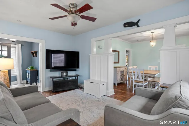 a living room with furniture and a flat screen tv