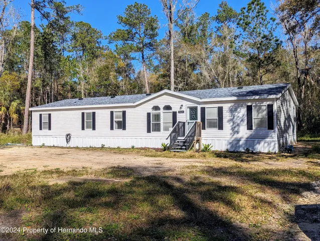 a view of a house with a patio