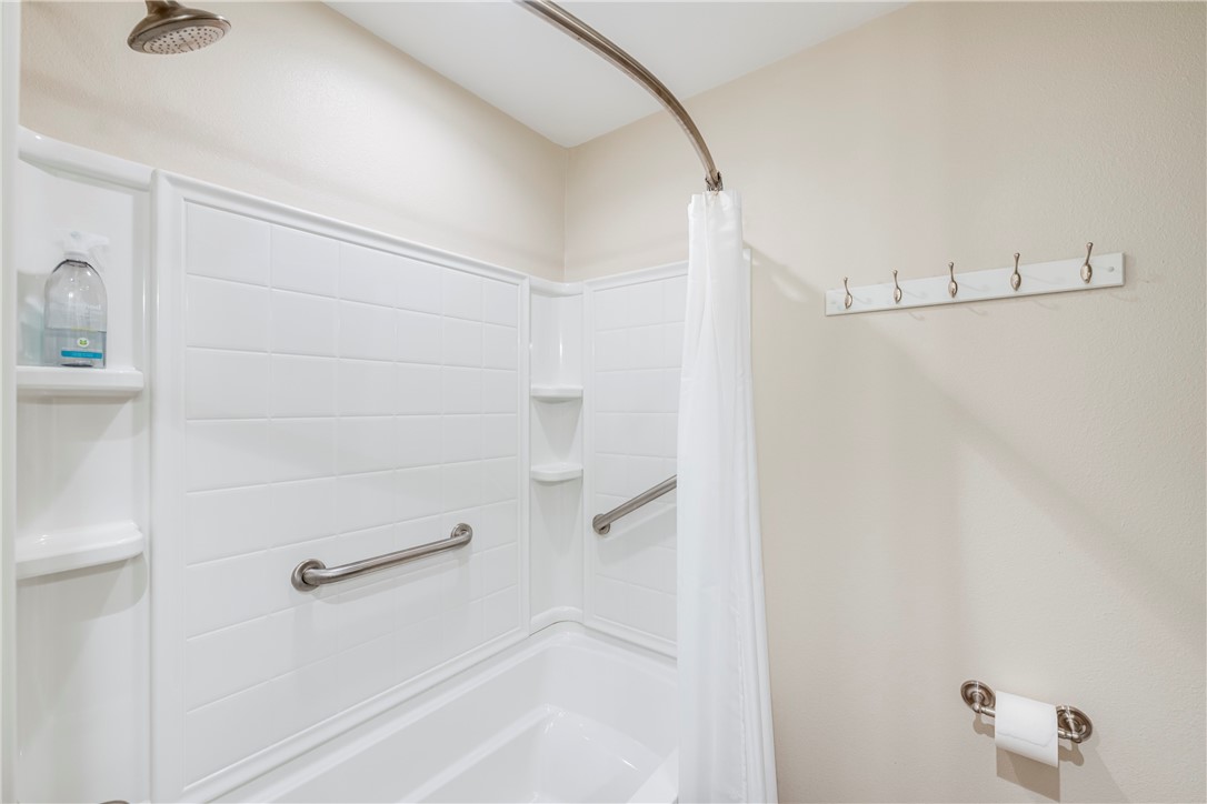230 Cut-Off Road, Unit 101 Port Aransas, TX 78373 - Photo 20 of 30 a bathroom with a shower